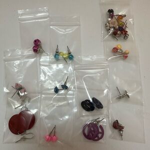 11 complete pairs of earrings and 2 bags of unmatched